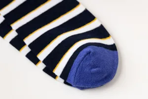 Close-up detail of men's striped cotton socks, showing knit texture and color blocking.