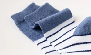 Comfortable kids cotton socks featuring classic blue and white stripes design for daily wear.