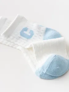 Infant breathable mesh baby socks detail view, soft cotton knit white and light blue color