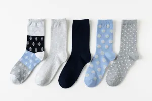 Detailed view of casual cotton mid-tube socks featuring assorted polka dot and snowflake patterns.