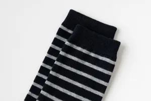 Close up detail of black and grey striped mid-calf cotton socks, soft and breathable daily wear