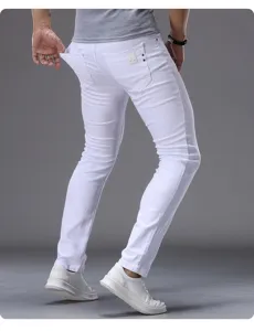 Men slim fit white jeans detail view, classic casual denim pants showing back pocket and fit.