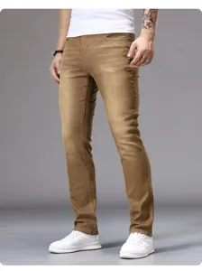 Mens casual slim fit skinny jeans in khaki color, detailed shot showing trouser cut and fit.