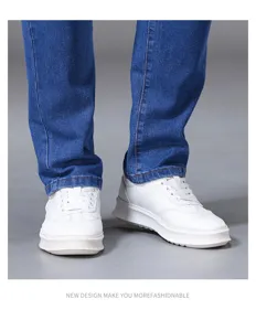 Detailed shot of men's slim-fit blue denim jeans paired with stylish white casual sneakers.