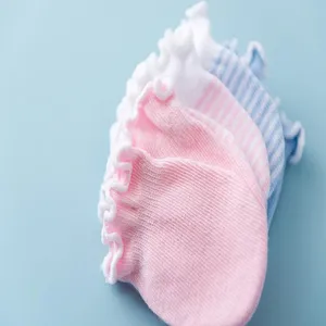 Soft cotton newborn baby anti-scratch mittens with cute ruffle edge and striped design.