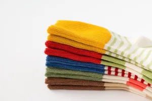 Detailed view of folded colorful striped cotton socks showing soft texture and cozy knit design.