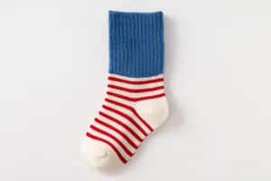 Cozy cotton kids mid-calf socks with blue ribbed cuff and red white stripes detail.