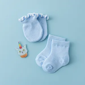 Cute cotton baby anti-scratch mittens and socks set in light blue, soft newborn accessories.
