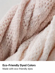 Soft knitted fabric close-up in pink macaron color, breathable and comfortable texture.