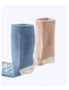 Infant breathable cotton floor socks with anti-slip sole and cute knit letters.