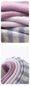 Soft knit baby socks fabric detail, comfortable texture with cute stripes and stretch cuffs.