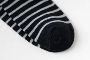 Comfortable striped cotton mid-tube socks detail shot, classic black and grey daily wear.