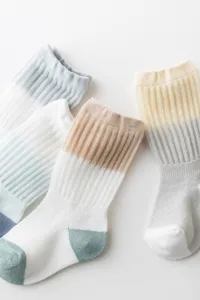 Breathable baby mesh long socks, soft cotton ice silk material, cute color block details.
