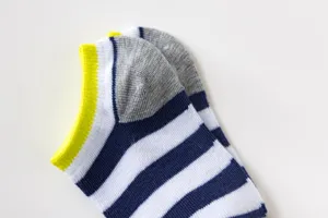 Close-up of children's striped ankle socks, detailed view of fabric and bright cuffs.
