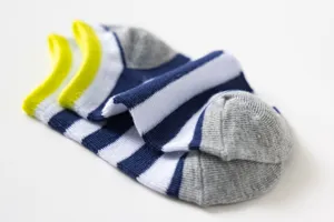 Detail shot of breathable striped kids boat socks with bright yellow trim and grey heel and toe.