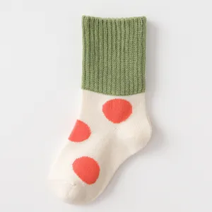 Cute cotton kids socks with green ribbed cuff and colorful polka dots, warm and comfortable.