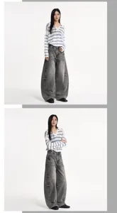 Jeans en denim courbé noir délavé vintage pour hommes et femmes, détails de coupe ample.
