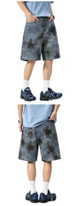 Loose fit blue camouflage denim shorts with metal button closure, perfect for trendy casual wear.
