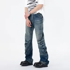 Men's blue distressed stacked flare jeans with multi-button front for street style fashion look.