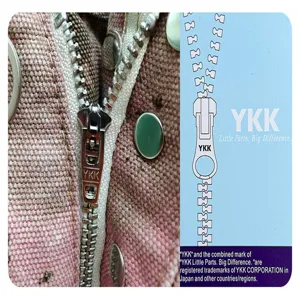 Close-up detail of garment fabric and durable metal zipper showing high quality construction.