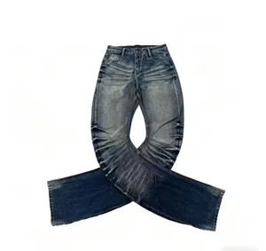 Close-up detail of vintage washed blue flared jeans with unique whiskered denim texture.