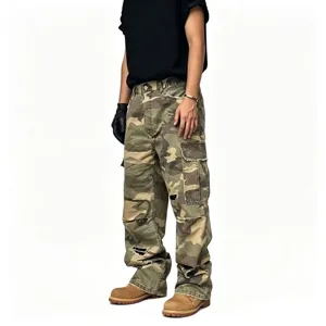 Detailed view of men's camo cargo pants with distressed holes, loose fit, streetwear style.