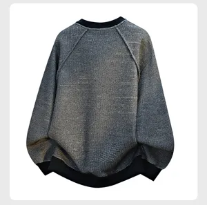 Detailed view of mens knit pullover sweatshirt fabric texture and ribbing collar.