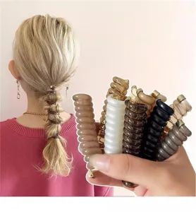 Set elastici per capelli a spirale, fermagli colorati filo telefonico dettaglio.