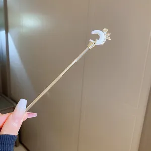 Close up detail view of the elegant crescent moon flower hairpin, showcasing fine craftsmanship.