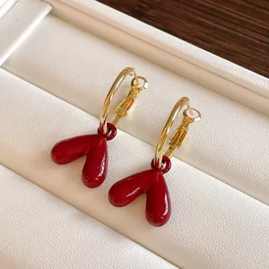 Retro red heart hoop earrings for women, chic gold-tone statement drop jewelry for autumn.