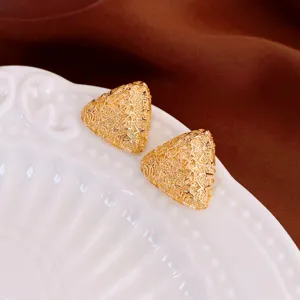 Elegant gold triangle stud earrings with luxury textured pattern and chic high-end design.