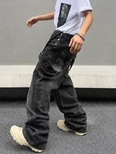 Detailed shot of men's casual distressed black wide leg denim cargo pants showcasing fit.