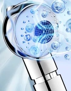 Close-up detail of modern metal handheld shower head with fine internal grid for high water pressure.