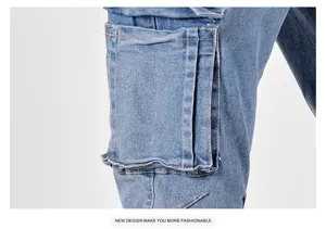 Close-up detail of mens blue denim cargo pants showing pocket and stitching design.