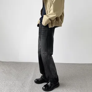 Men's retro distressed baggy denim jeans for autumn winter vintage streetwear fashion.