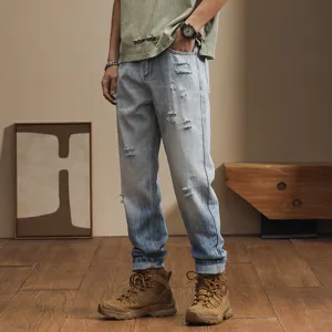 Japanese loose casual distressed gradient jeans for men, stylish tapered harem pants.