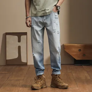 Men's loose trendy harem jeans, spring summer casual distressed gradient denim pants fashion.