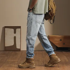 Men's casual loose distressed light blue jeans vintage harem pants streetwear fashion trousers