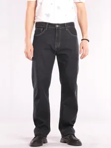 Detailed view of men's dark denim jeans, straight fit design, premium fabric with contrast stitching.
