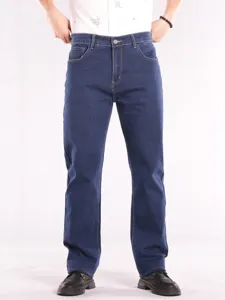 Detailed view of dark blue straight-fit denim jeans with contrast stitching and metal button.