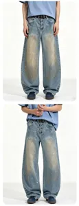 Men loose washed light blue denim jeans with metal front clasps and paint splatter effects.