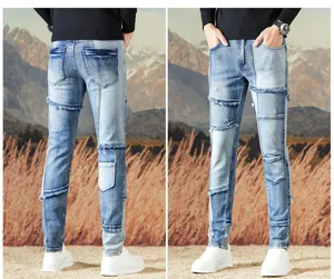 Jeans ajustados de mezclilla para hombre vintage de moto con detalles de patchwork.