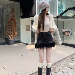 Jupe courte en jean pour femme élégante avec franges en plumes tendance high street slim