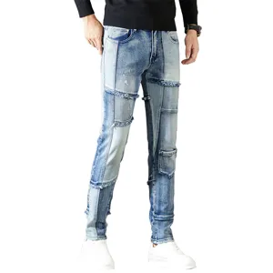 Jeans de mezclilla desgastados con patchwork vintage para hombre, corte recto slim con flecos.
