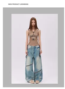 Washed vintage distressed loose asymmetric zipper straight leg denim jeans detail view.