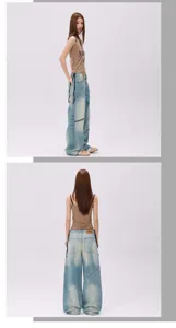 Detailed view of the vintage washed distressed asymmetric patchwork loose unisex straight jeans.