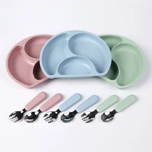 Kids silicone divided plate and fork spoon set, baby feeding tableware in pastel colors.