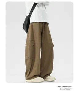 Detailed side view of brown loose wide-leg cargo pants with 3D tailoring and retro style.