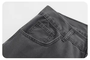 Detailed view of American retro dark gray casual pants waistband and pocket design, premium fabric.