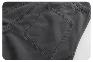 Detailed view of the dark grey vintage casual pants back pocket with neat stitching.